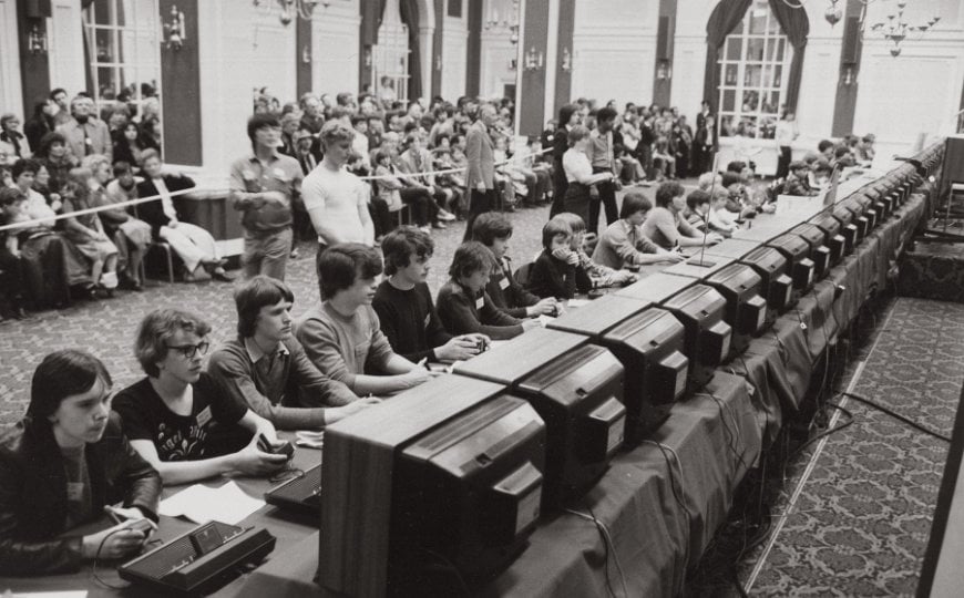 A photo of gamers playing in the Atari Space Invaders championship